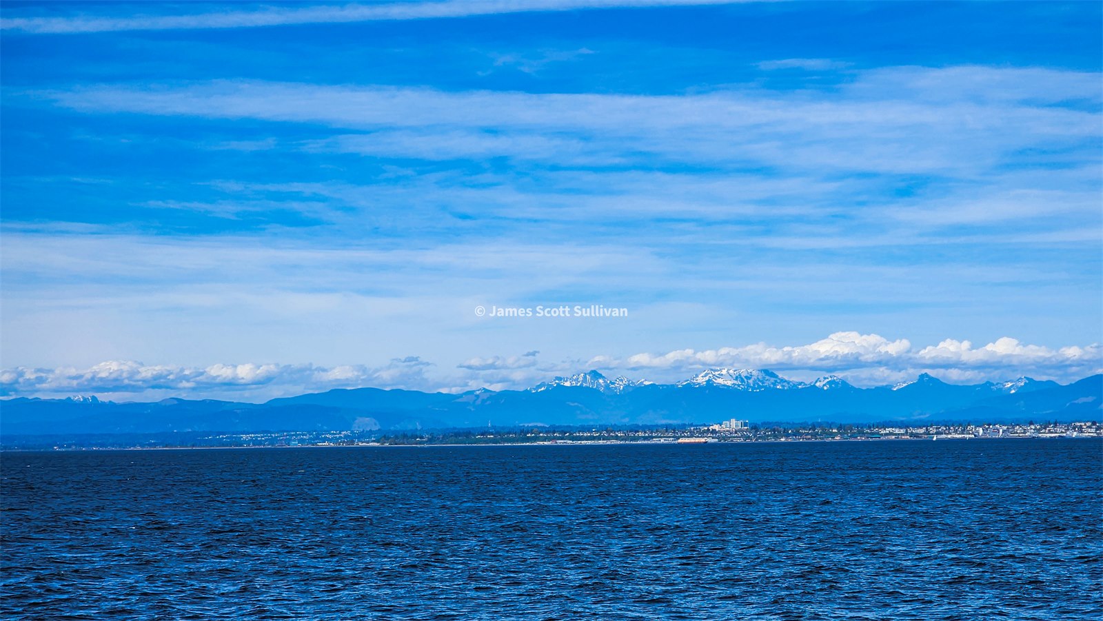 Blue water and distant land on the westward push toward Seattle.