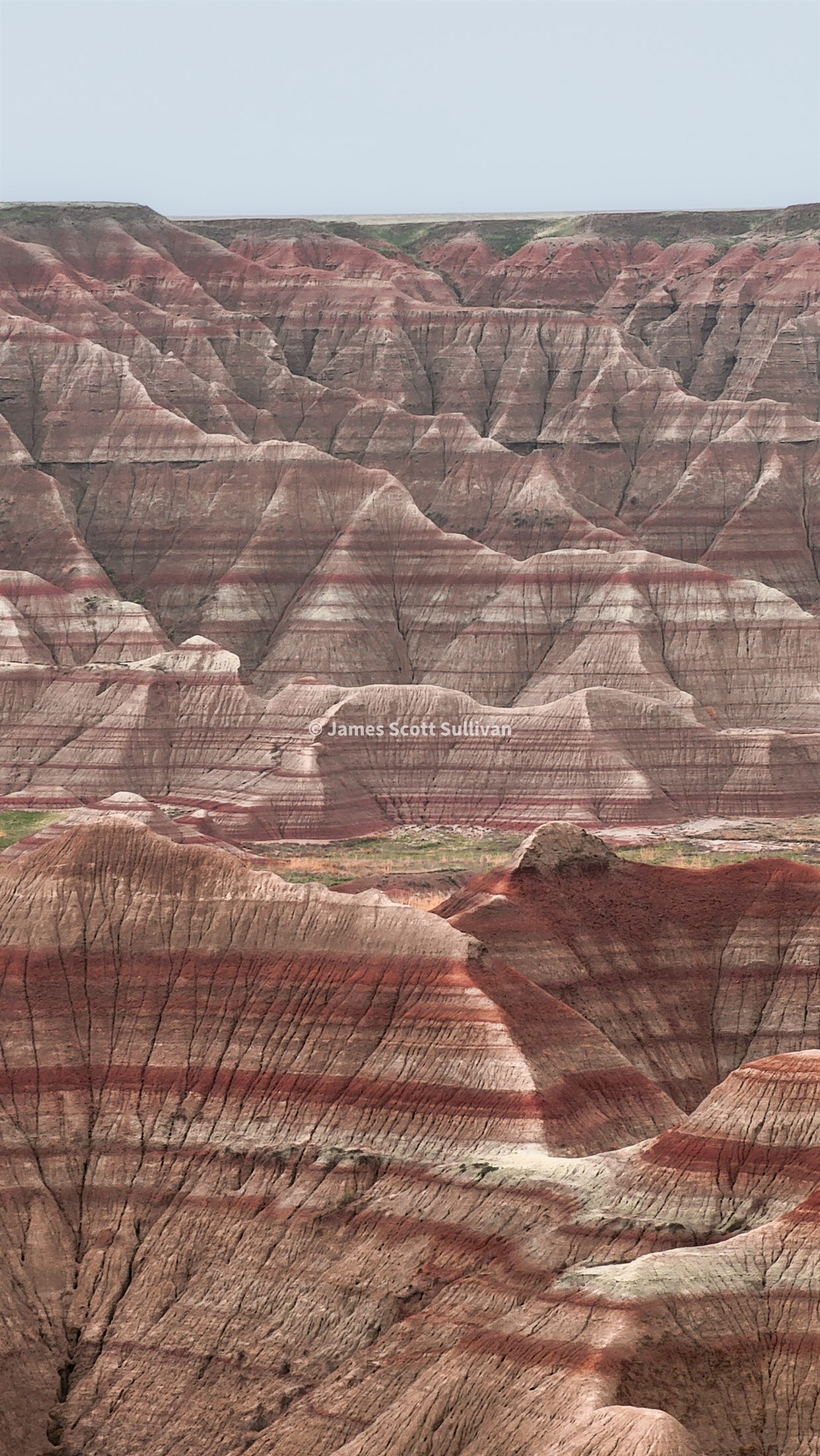 Layered rock formations in Badlands National Park.