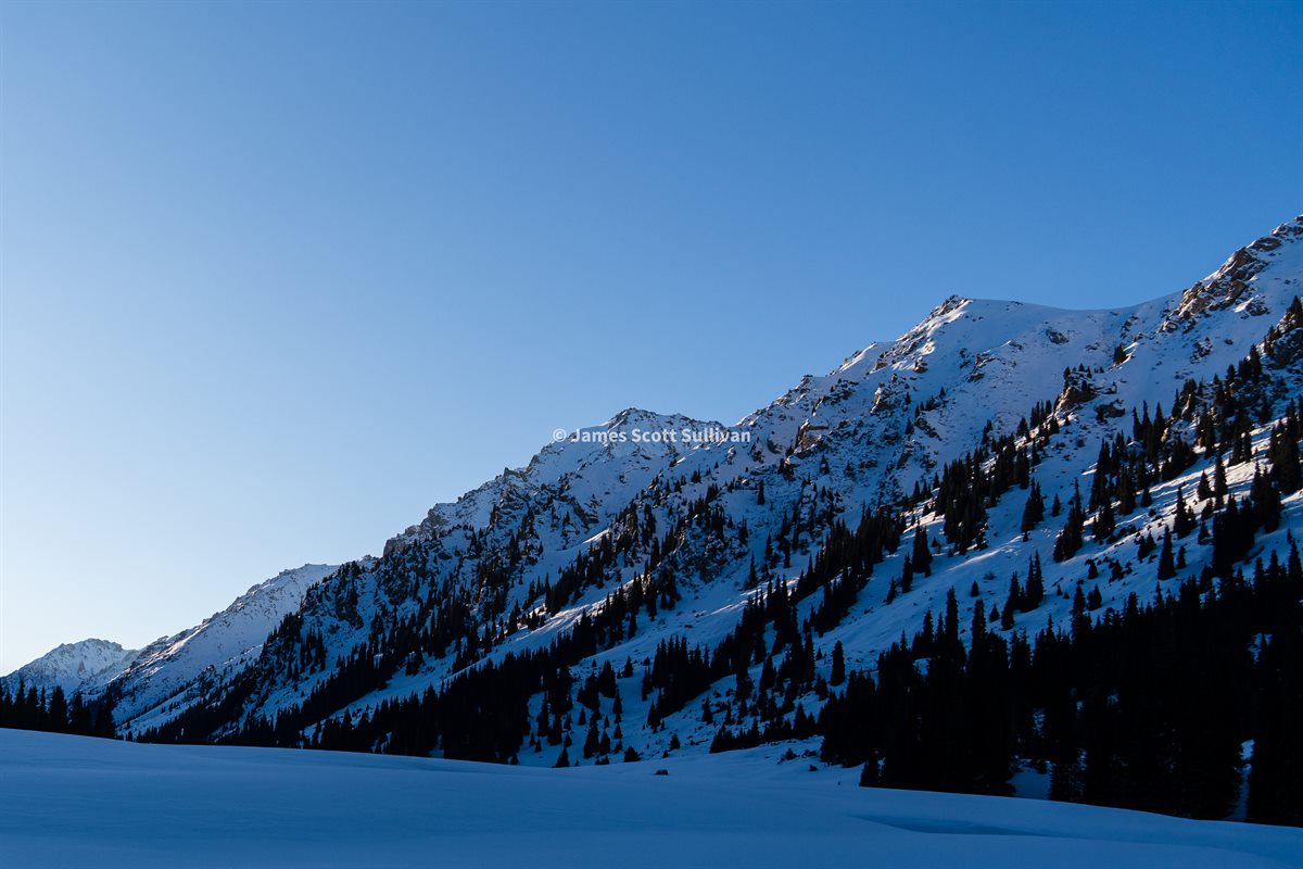 Snowy mountain view from camp in Aksuu Gorge during a ski tour in Kyrgyzstan.